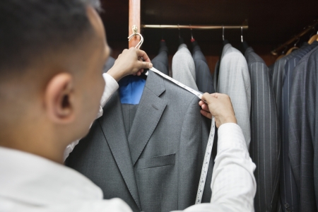 Tailor measuring shoulder of the suitの写真素材