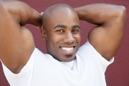 Portrait of a young physically fit African American man with hands behind headの写真素材