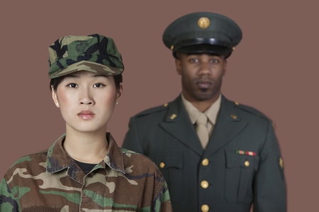 Portrait of young female US Marine Corps soldier with male officer in backgroundの写真素材