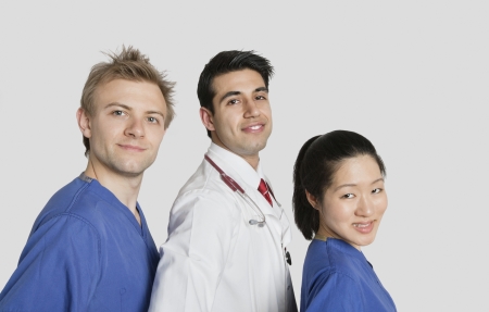 Portrait of multi ethnic medical team over gray backgroundの写真素材
