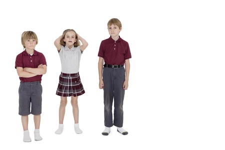 Portrait of school friends standing together over white background