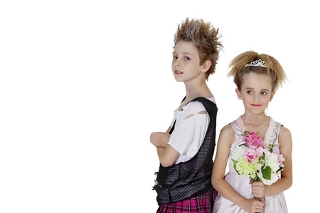 Portrait of punk boy with bridesmaid holding flower bouquet over white backgroundの写真素材