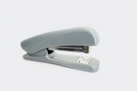 Close-up view of office stapler over white backgroundの写真素材