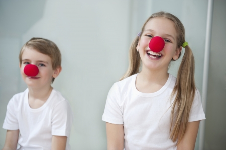 Portrait of children wearing clown nosesの写真素材