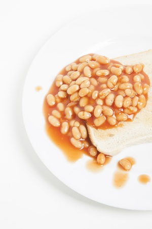 Baked beans and bread in plateの写真素材
