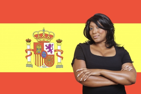 Portrait of casual mixed race woman against Spanish flagの写真素材