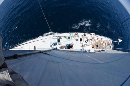 Sailboat at sea fisheye lens view from aboveの写真素材