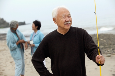 Fisherman on beachの写真素材