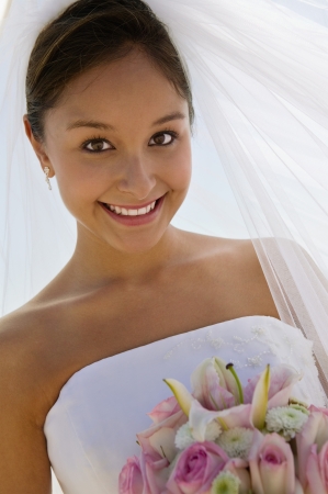 Bride with bouquet outdoors (close-up) (portrait)の写真素材