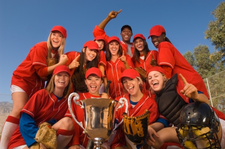 Women's softball team with trophy portraitの写真素材
