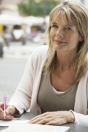 Woman Writing Postcardsの写真素材