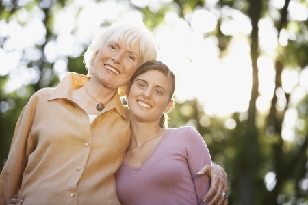 Grandmother and Granddaughter in back yard portrait low angle view