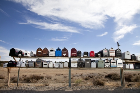 Front view of rows of mailboxes in desertの写真素材