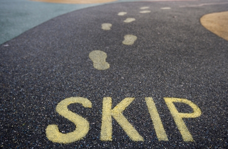 Skip written into rubber flooring of children's playgroundの写真素材