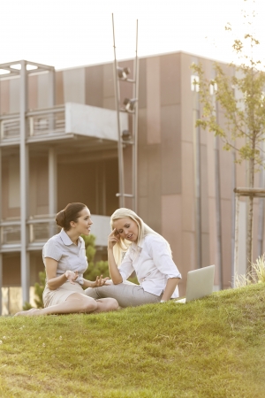 Young businesswomen arguing on office lawnの写真素材