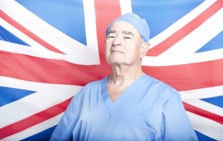 Portrait of a Senior Adult Surgeon in front of a British Flagの写真素材