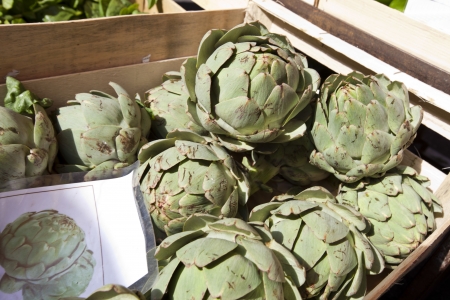 Fresh artichoke in container at marketの写真素材