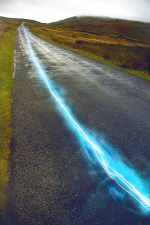 Fiber optic cable running above ground in the British Countrysideの写真素材