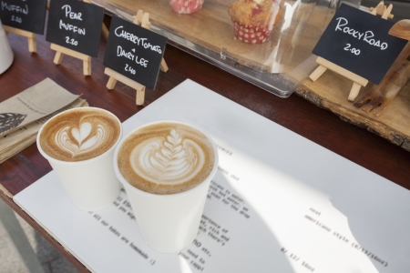 Disposable coffee cups on table