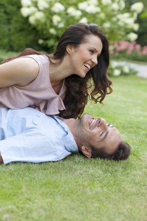 Playful young couple having leisure time in parkの写真素材