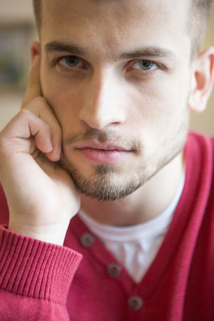 Close-up portrait of confident man in cafeの写真素材
