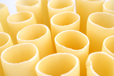 Cannelloni raw pasta on white backgroundの写真素材