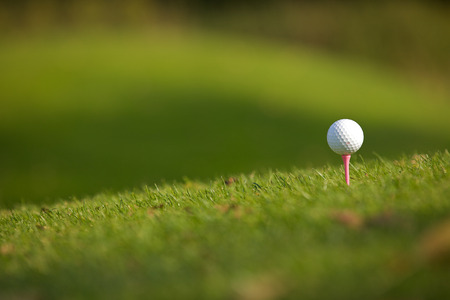 Golf ball on teeの写真素材