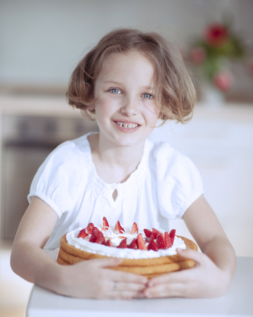 Young girl with cakeの写真素材
