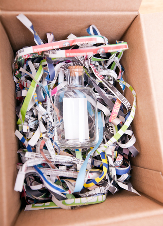 Glass bottle wrapped in a boxの写真素材