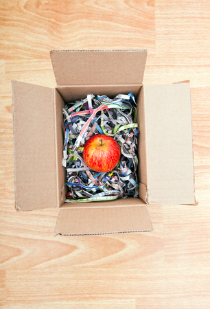Apple wrapped up in a boxの写真素材