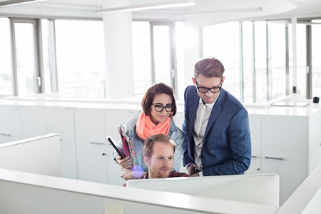 Business people working on computer in creative officeの写真素材