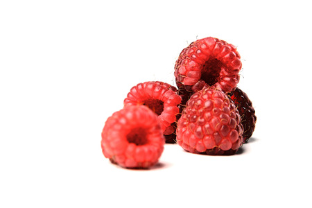 Close-up of raspberries on white background