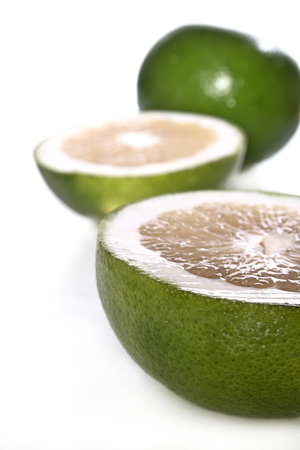 Green grapefruits on white backgroundの写真素材
