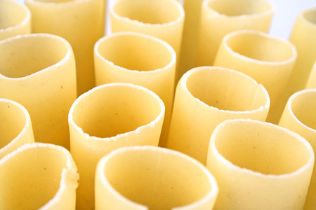 Cannelloni raw pasta on white backgroundの写真素材