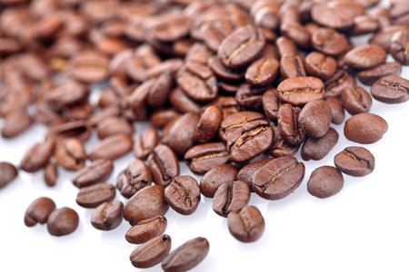 Rosted coffee grains on white backgorundの写真素材