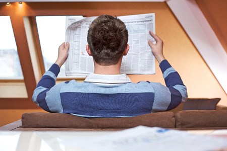 Man reading newspaperの写真素材