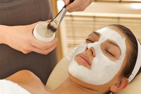 Close-up of young woman with facial maskの写真素材