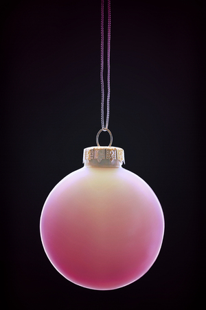 Pink bauble on black backgroundの写真素材