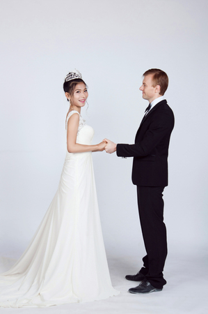 Mixed Race Bride and Groom in Studioの写真素材