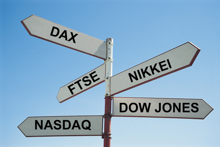 Sign post with various stock exchanges written on themの写真素材