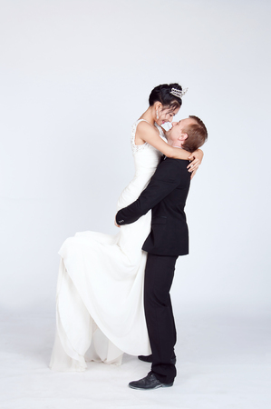 Mixed Race Bride and Groom in Studioの写真素材