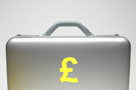 Silver briefcase with sterling symbol on itの写真素材