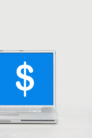 Laptop with dollar symbolの写真素材