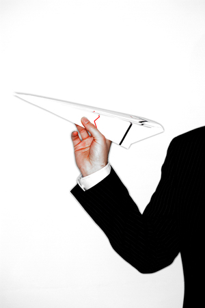 Businessman Throwing Paper Airplaneの写真素材