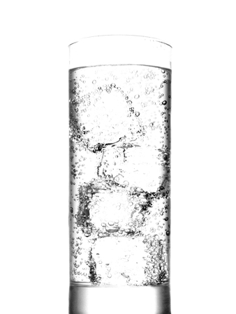 Glass of water with ice cubes on white backgroundの写真素材