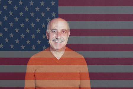 Armenian man standing infront of US Flagの写真素材