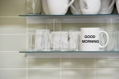Cup on shelf with Good morning Textの写真素材