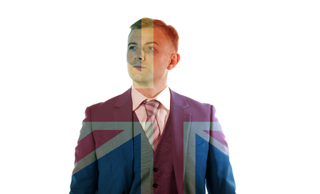 Portrait of an business man with black eye standing over Union Jackの写真素材
