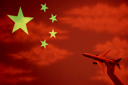 China and person holding toy airplaneの写真素材
