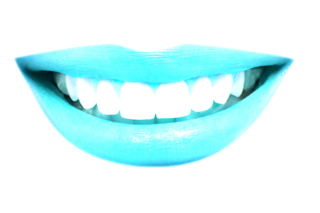 Closeup of beautiful blue lips smile with healthy teeth on white backgroundの写真素材